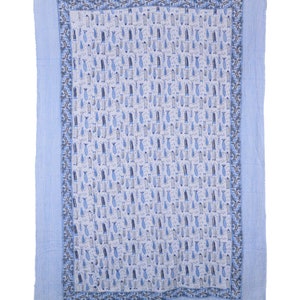 May include: A blue and white cotton quilt with a pattern of small fish. The quilt has a blue border with a white stripe.