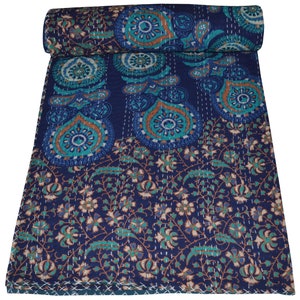 May include: A blue and green kantha quilt with a paisley and floral pattern. The quilt is made of cotton and is hand-stitched.