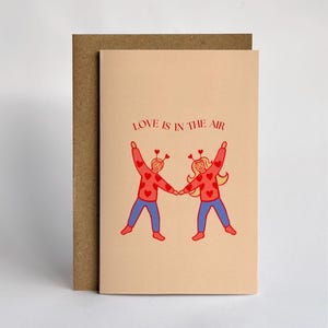 Carte de voeux d'anniversaire de L'amour est dans l'air