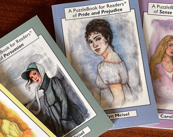 May include: Five paperback books with watercolor illustrations of women on the covers. The books are titled "A PuzzleBook for Readers of Mansfield Park", "A PuzzleBook for Readers of Northanger Abbey", "A PuzzleBook for Readers of Persuasion", "A PuzzleBook for Readers of Pride and Prejudice", and "A PuzzleBook for Readers of Sense and Sensibility".