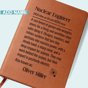 May include: A brown leather-bound notebook with the text "Nuclear Engineer" and a definition. The name "Oliver Miller" is printed at the bottom. A bookmark is visible.