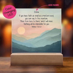 May include: A color-changing LED light with a wooden base displays a sunset landscape with mountains and a quote: "If you have faith as small as a mustard seed, you can say to this mountain, 'Move from here to there, and it will move. Nothing will be impossible for you.' Matthew 17:20-21"