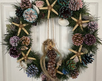 Blonde swinging mermaid pinecone wreath,