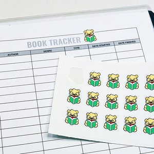 May include: A sheet of stickers with illustrations of bears wearing glasses and reading books. The stickers are on a white background and are arranged in a grid pattern.
