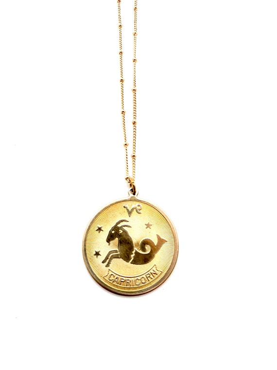 Vintage brass capricorn disc coin medallion charm… - image 1