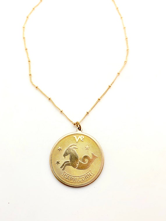 Vintage brass capricorn disc coin medallion charm… - image 6