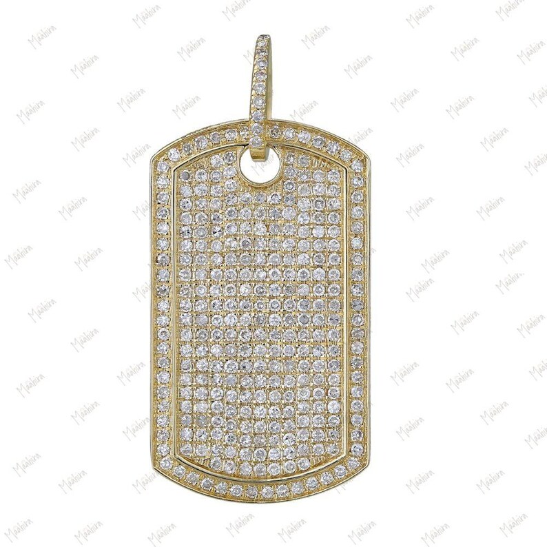 May include: A gold dog tag pendant with a pave setting of small, clear diamonds.