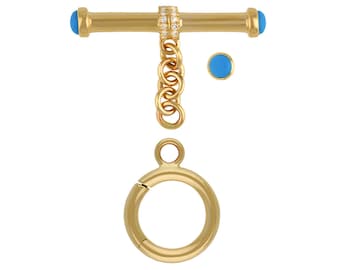 May include: Gold-tone toggle clasp with a blue stone on each end, a chain, and a round ring. The chain has a row of clear stones.