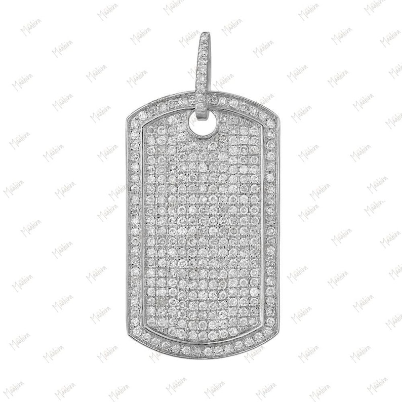 May include: A silver dog tag pendant with a pave setting of small, clear diamonds.