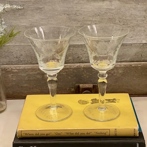 May include: A set of three ceramic mugs with a speckled, matte finish. The mugs are in shades of cream, light gray, and dark gray. Each mug has a simple, minimalist design, perfect for coffee or tea.