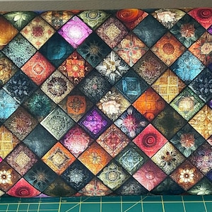 May include: A fabric with a repeating pattern of colorful, ornate squares. The squares feature floral and geometric designs in shades of red, blue, green, orange, and purple. The overall effect is reminiscent of stained glass or mosaic tiles.
