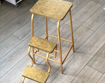 Step stool adult. Step ladder. Library step stool. Folding bar stool. Industrial plant stand. Stepladder with golden legs. Kitchen chair