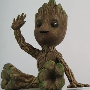 Sitting waving baby groot image 1