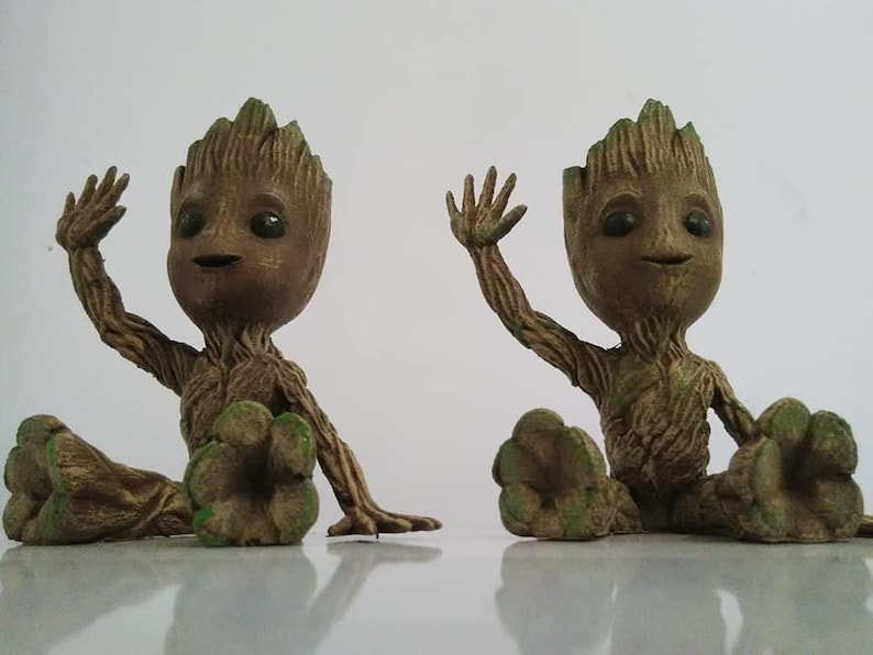 Sitting waving baby groot image 2