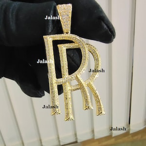 May include: A set of three ceramic mugs with a speckled, matte finish. The mugs are in shades of cream, light gray, and dark gray. Each mug has a simple, minimalist design and a rounded handle.