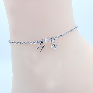 Cavigliera Hotwife. Discreto bracciale alla caviglia in acciaio inossidabile H W.