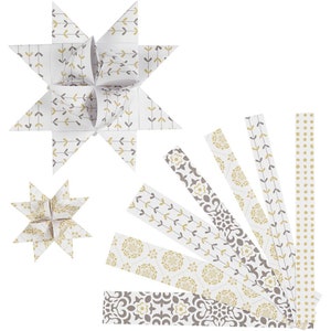 May include: A set of eight paper strips with different patterns in shades of grey and gold. The strips can be used to make origami stars. The strips are shown with two finished origami stars.