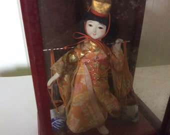oriental dolls in glass cases