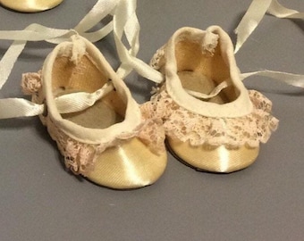 Doll Shoes ~ 2 1/4" x 1 1/4" cream colored satin, trimmed with lace & tie up the ankle