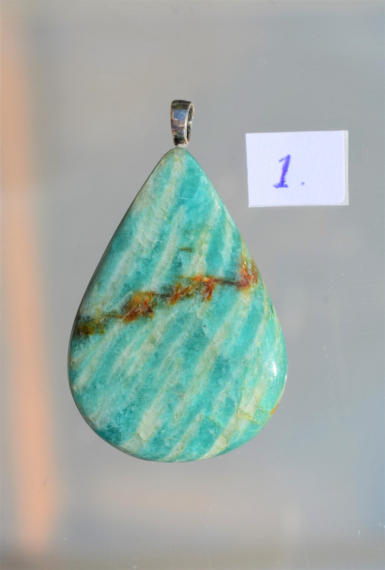Beautiful drop-shaped cut gemstone from Amazonite as a necklace with a sterling silver pendant eye. semi