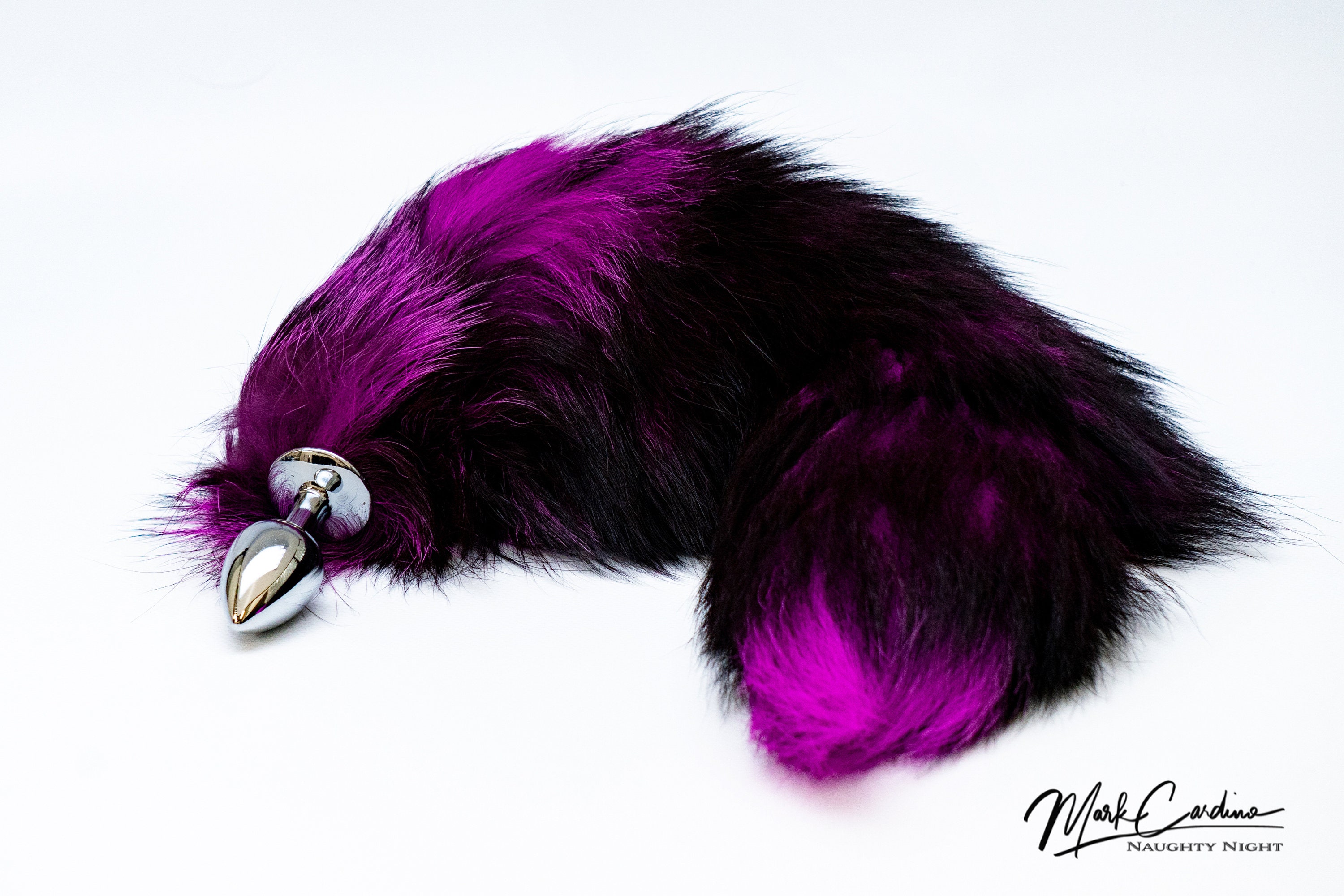 With these gorgeous Purple and Black foxtail butt plugs, you'll have a...