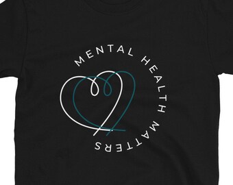 May include: Black t-shirt with a white circle graphic that says "Mental Health Matters" with a teal heart design inside the circle.