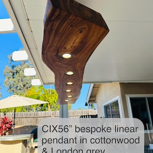 CIX LIVE EDGE linear pendant chandelier in black walnut and brushed aluminum