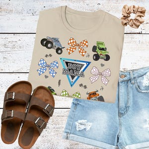 Coquette Monster Truck shirt boy mom checkered design tee monster jam mom t-shirt bow crushing motherhood gift for mama of birthday boy Sand