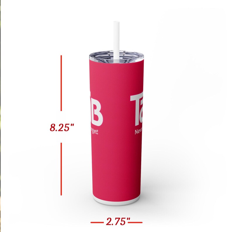 May include: A pink stainless steel tumbler with a white lid and straw. The tumbler is 8.25 inches tall and 2.75 inches wide. It features the words "Tab" and "Never Forget!" in white text.