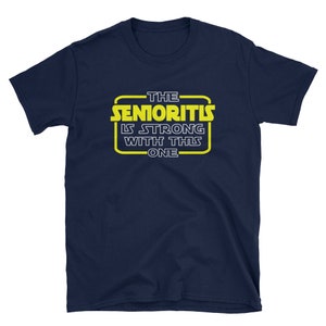 May include: Navy blue t-shirt with a yellow graphic that says "The Senioritis Is Strong With This One".