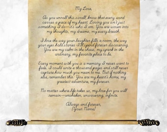 May include: A tan parchment scroll featuring black cursive text that begins with My Love and ends with Your Name. The scroll is held by two dark metal rods with ornate ends. A separate rolled parchment section with a red wax seal is below.