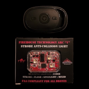 May include: A black box with the text "FIREHOUSE TECHNOLOGY ARC "V" STROBE ANTI-COLLISION LIGHT" and a red circuit board with multiple LEDs inside. The box also has the text "FIREHOUSE TECHNOLOGY" and "MULTIPLE LIGHTING MODES STROBE: FLASH: SPOTLIGHT: MIXED FAA COMPLIANT FOR ALL DRONES".