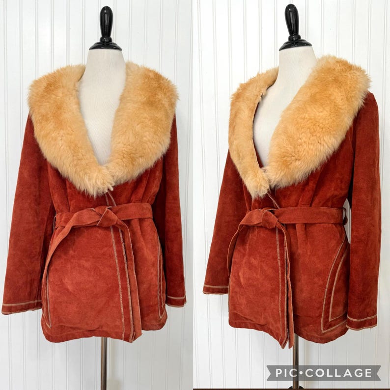 May include: Rust-colored suede coat with a faux fur collar and matching belt. The coat features a wrap design and is displayed on a mannequin. The collar is a light tan color, and the coat has a vintage aesthetic.
