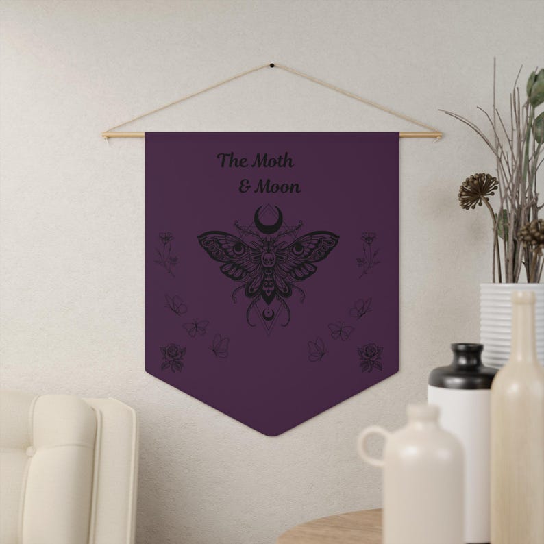 a bathroom with a purple towel hanging on a rack, a shelf with toiletries, and two potted plants.