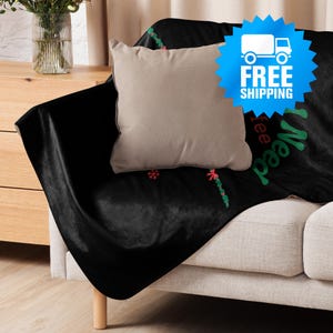 a couch with a blanket and a pillow on it