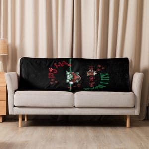 a couch with a black blanket on top of it