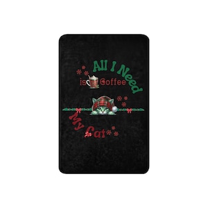 a black towel with a picture of a cat on it
