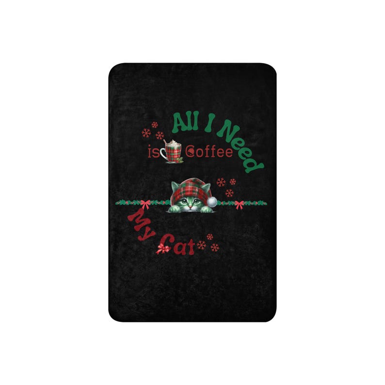 a black towel with a picture of a cat on it
