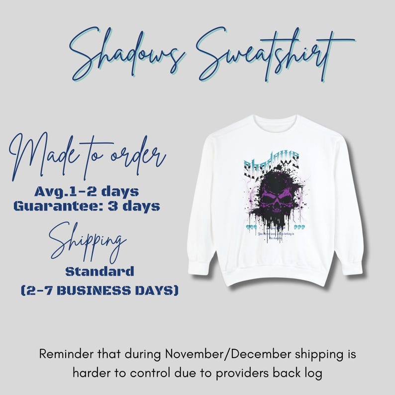 A white crewneck sweatshirt with a purple and black skull design, splattered with black ink, and the word "Shadows" above it in blue and white, next to text about shipping and production.