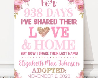 May include: Pink and gold floral design with the text "For 938 days I've shared their love & home, but now I share their last name! Elizabeth Mae Johnson Adopted: November 8, 2022".