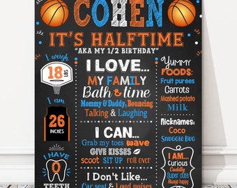 May include: A chalkboard style birthday sign for a boy named Cohen, celebrating his half birthday. The sign features a basketball theme with orange and blue accents. It includes details like his weight, height, favorite things, and personality traits.