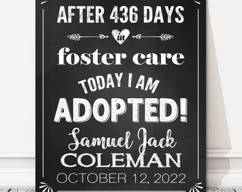 May include: Black and white chalkboard sign with the text "AFTER 436 DAYS in foster care TODAY I AM ADOPTED! Samuel Jack COLEMAN OCTOBER 12, 2022".