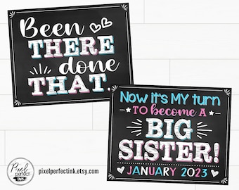 May include: Two chalkboard signs announcing a new baby. The top sign reads "Been there done that." The bottom sign reads "Now it's my turn to become a big sister! January 2023."