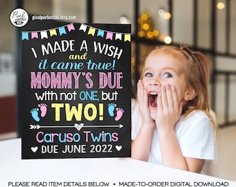 May include: A chalkboard sign with a pink and blue bunting at the top. The sign reads "I made a wish and it came true! Mommy's due with not one, but TWO! Caruso Twins Due June 2022".
