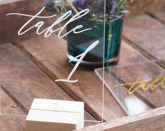 Wedding plexi table number and its wooden support