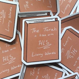 May include: A collection of stickers featuring a brown book design with the text "The Torah is Filled with Living Words" and the initials "HLS" in white. The stickers have a white border.