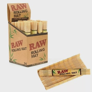 May include: A cardboard box and bamboo rolling mats. The box is labeled "RAW ROLLING MAT" in red letters with bamboo leaf illustrations. The mats are made of thin bamboo sticks and have a label that reads "RAW ROLLING MAT".