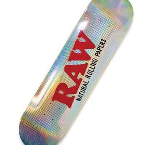 May include: A skateboard with a holographic, iridescent finish. The word "RAW" is printed in red, along with "NATURAL ROLLING PAPERS". The board has a rounded shape and is designed for skateboarding.