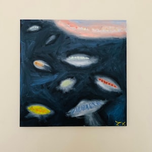 May include: Abstract painting on canvas with a dark blue background and various shapes in shades of blue, white, yellow, orange, and red. The shapes are reminiscent of fish or other aquatic creatures.