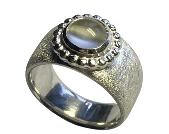 Silver ring with moonstone in a ball ring setting, handmade